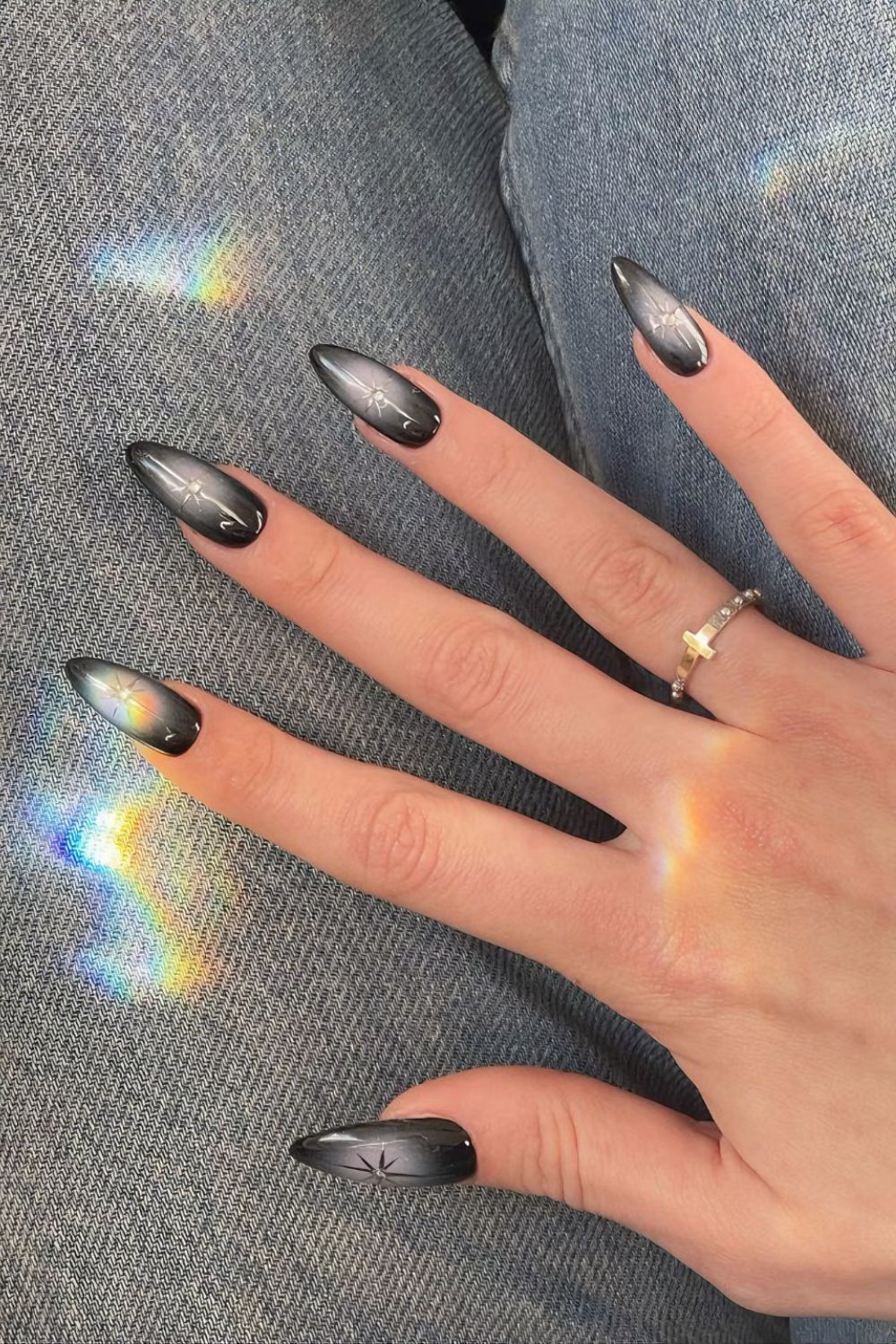 Black and gray aura nails with silver chrome stars