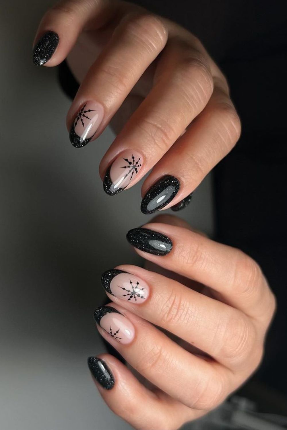 Black holiday nails with glitter and snowflakes