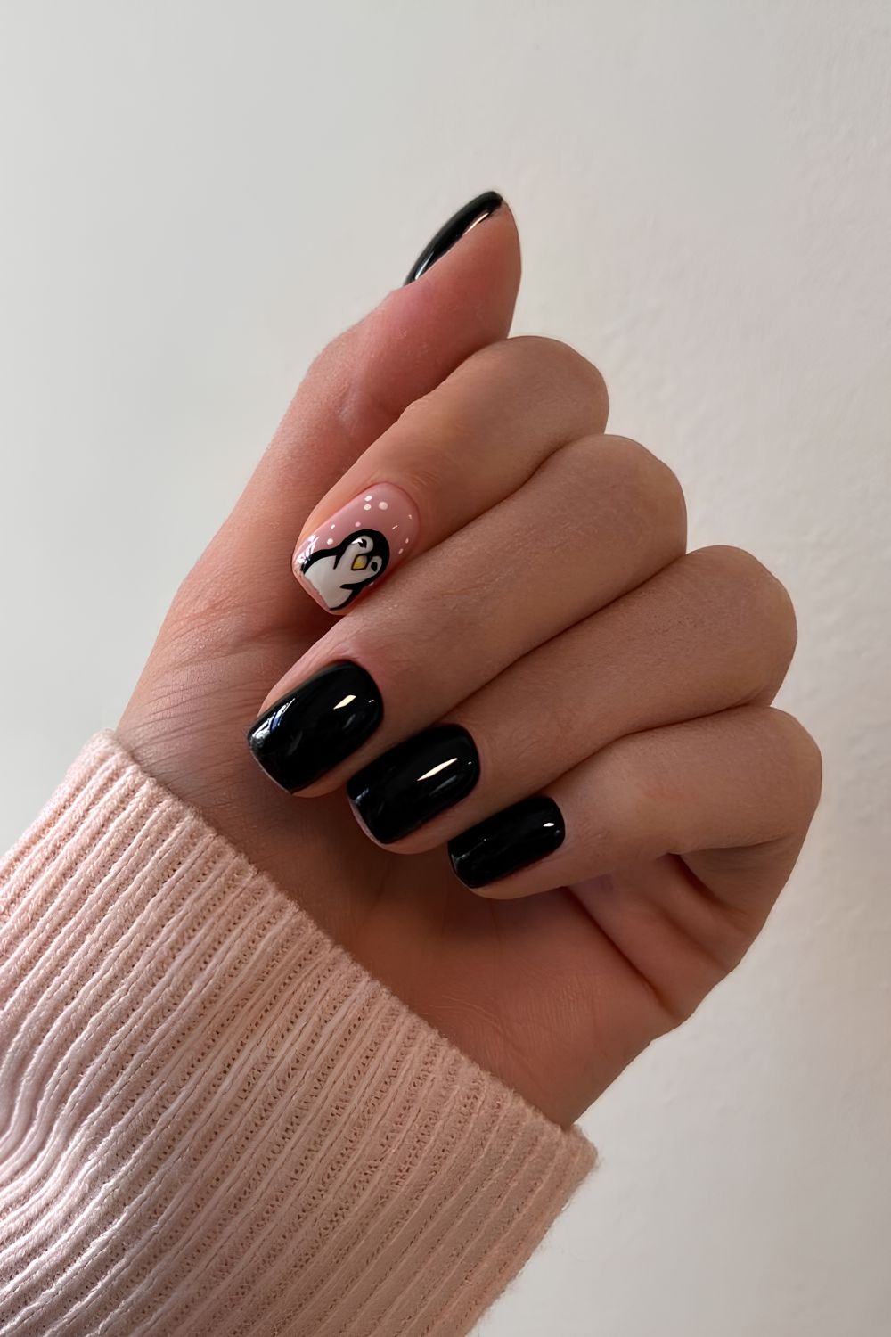 Black nails with cute penguin art