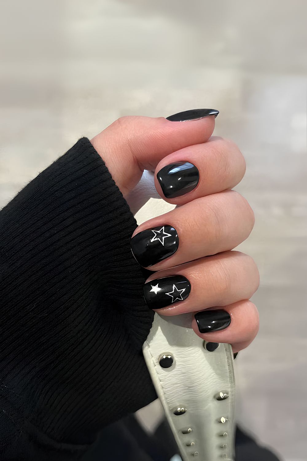 Black nails with white star accents