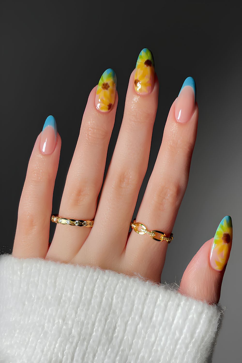 Blue French nails with sunflower art