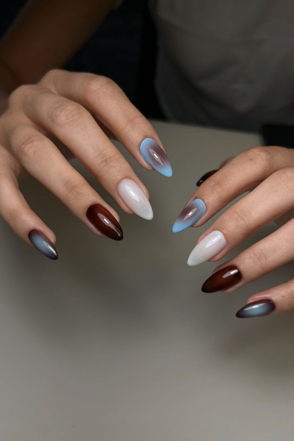 Brown, blue and white aura nails