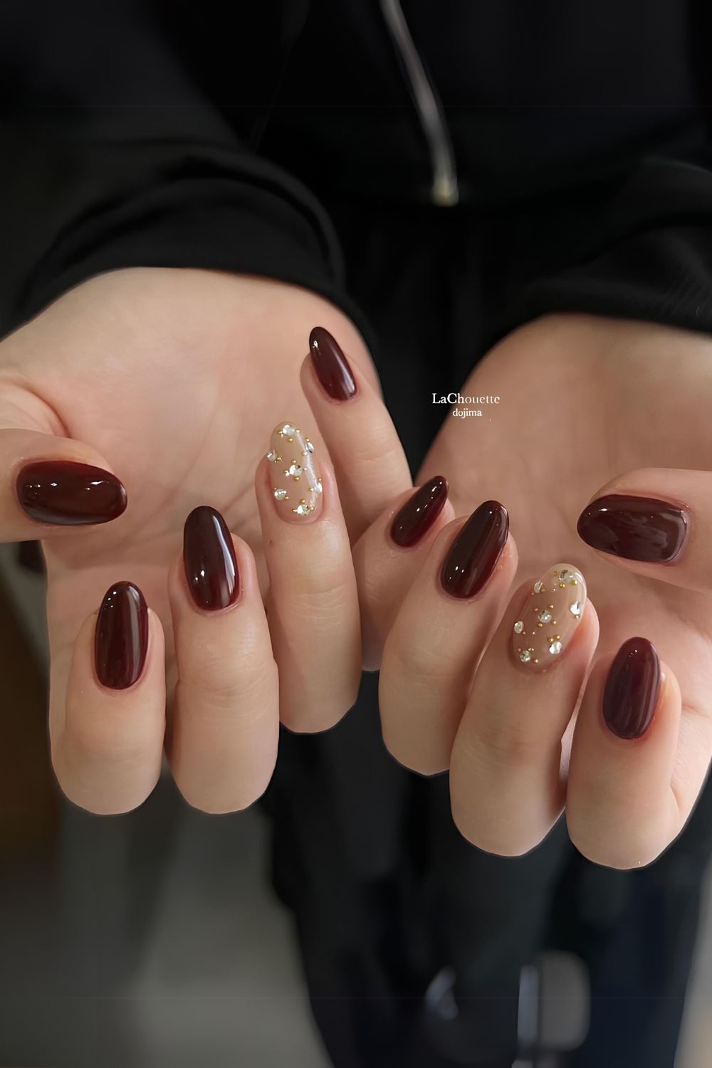 Brown nails with rhinestone accents