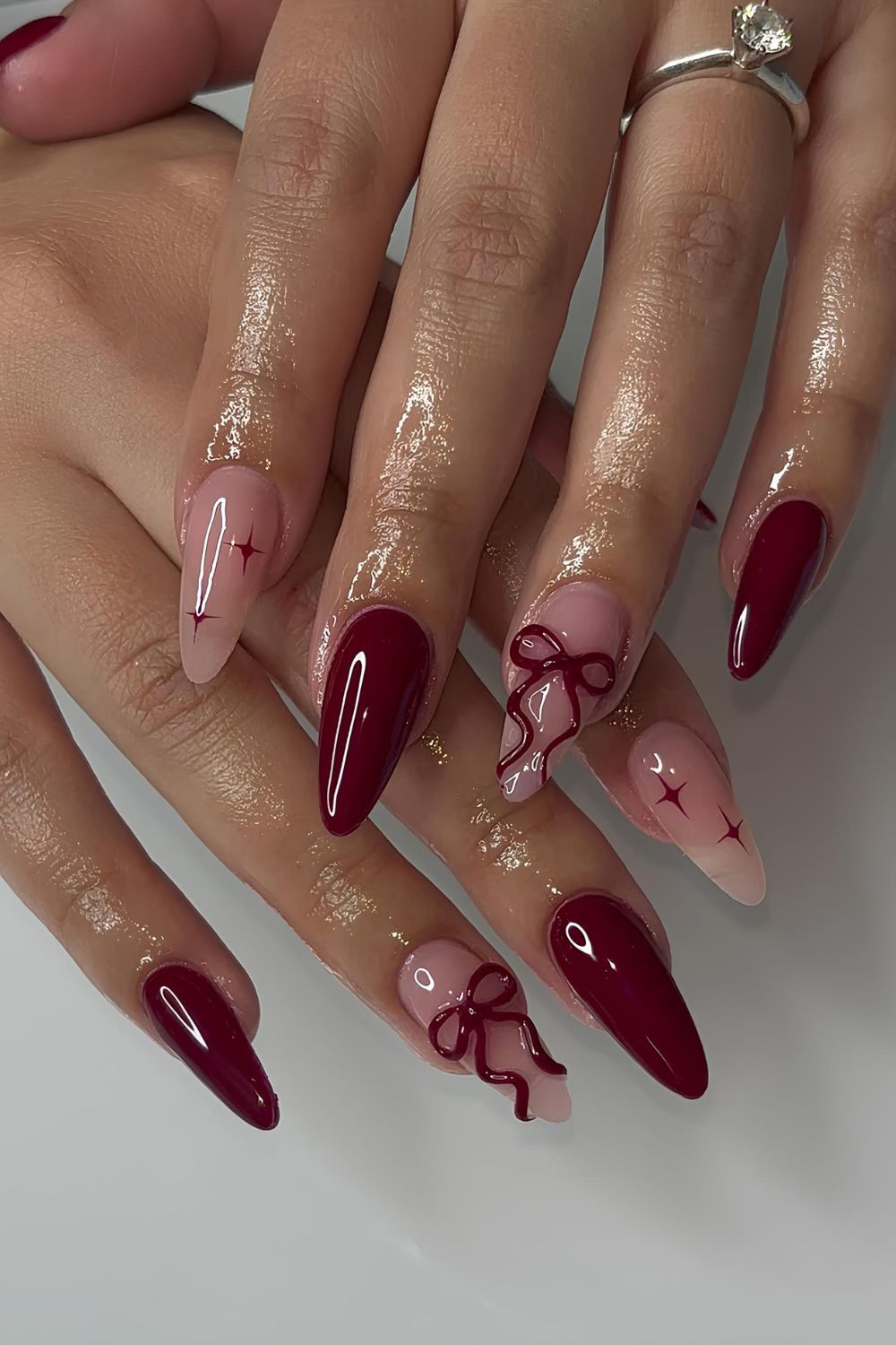 Burgundy coquette mani with 3D bows