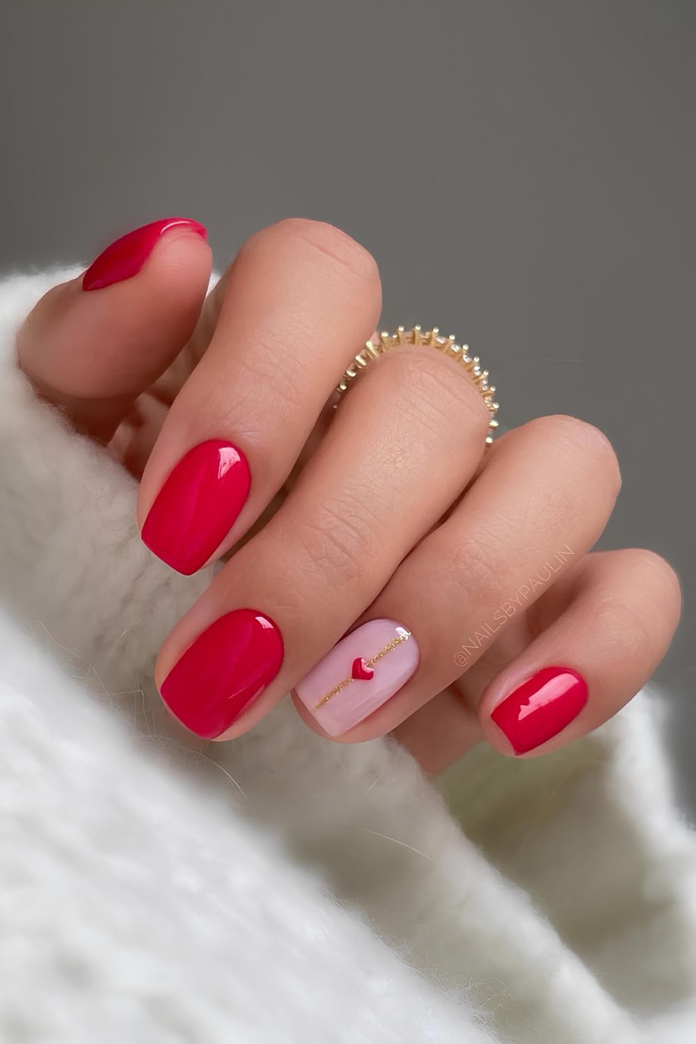 Classic red nails with heart and gold line accents