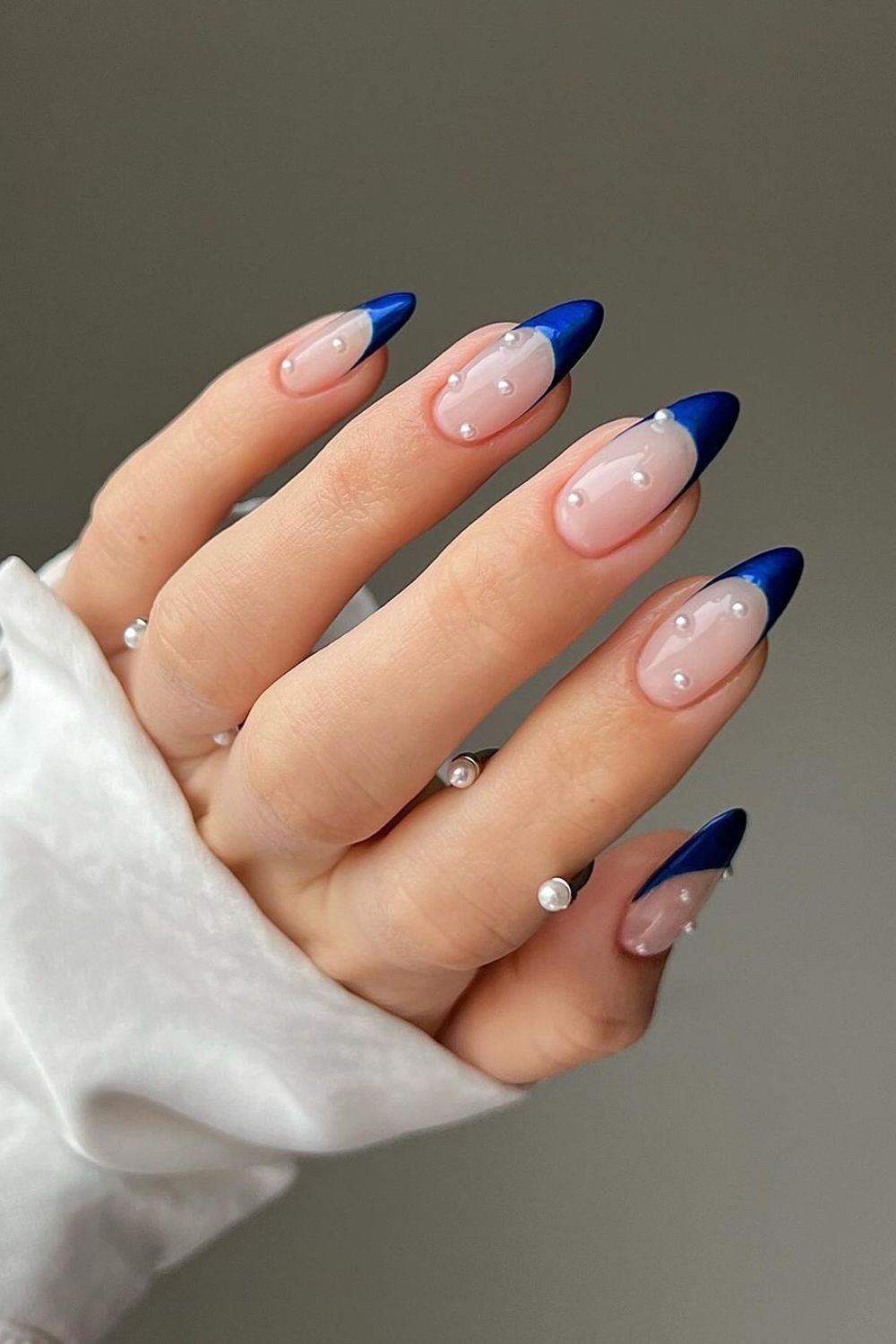 Cobalt blue french tip nails with pearly accents