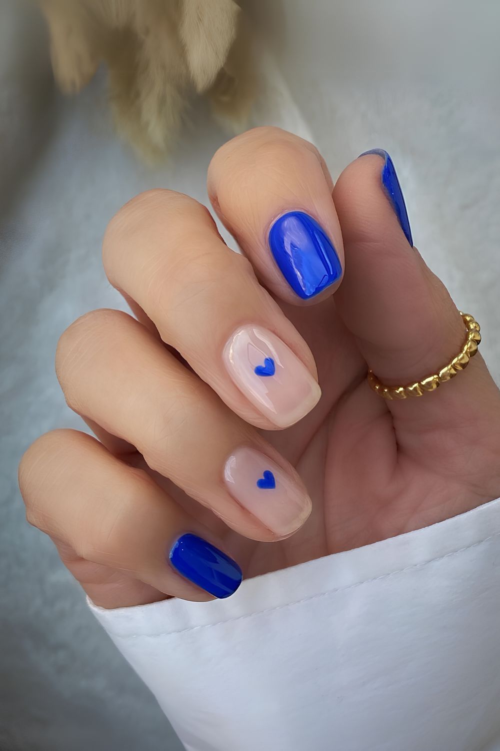 Cobalt blue manicure with heart accents