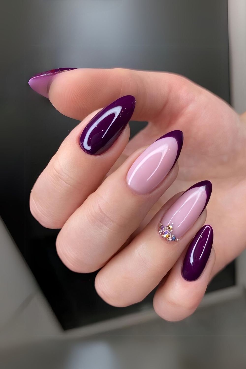 Dark purple nails with rhinestones