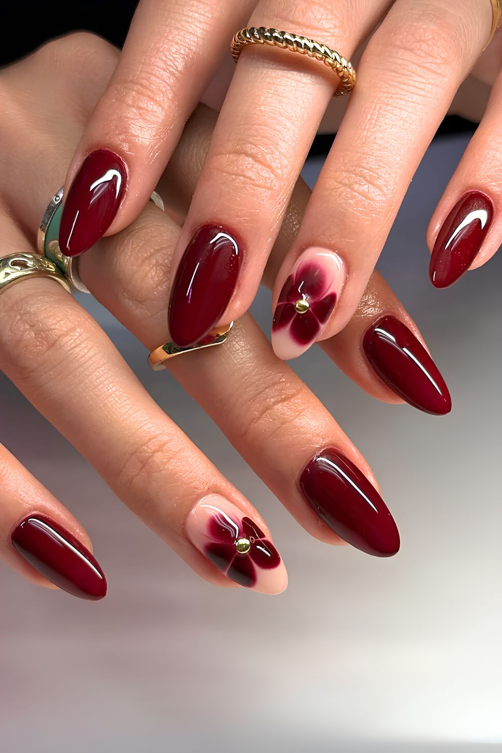 Deep red mani with blooming flower accents