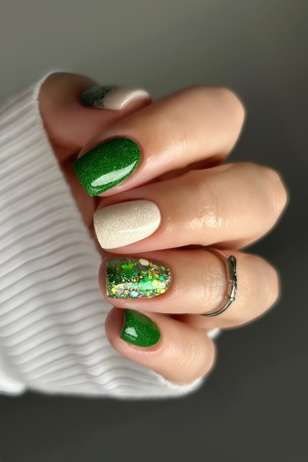 Green and white skittle nails with glitter accents