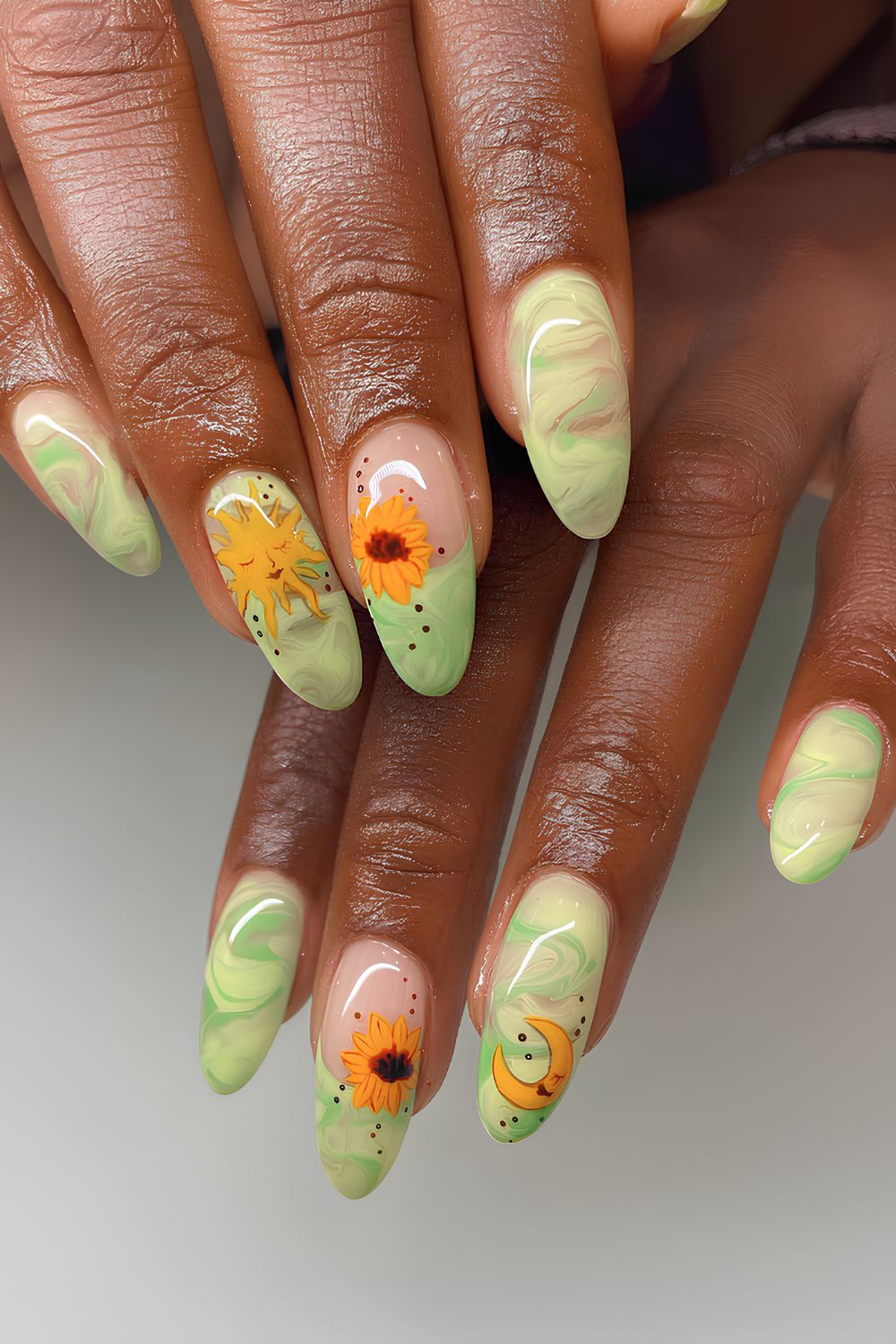 Green marble nails with sunflower accents