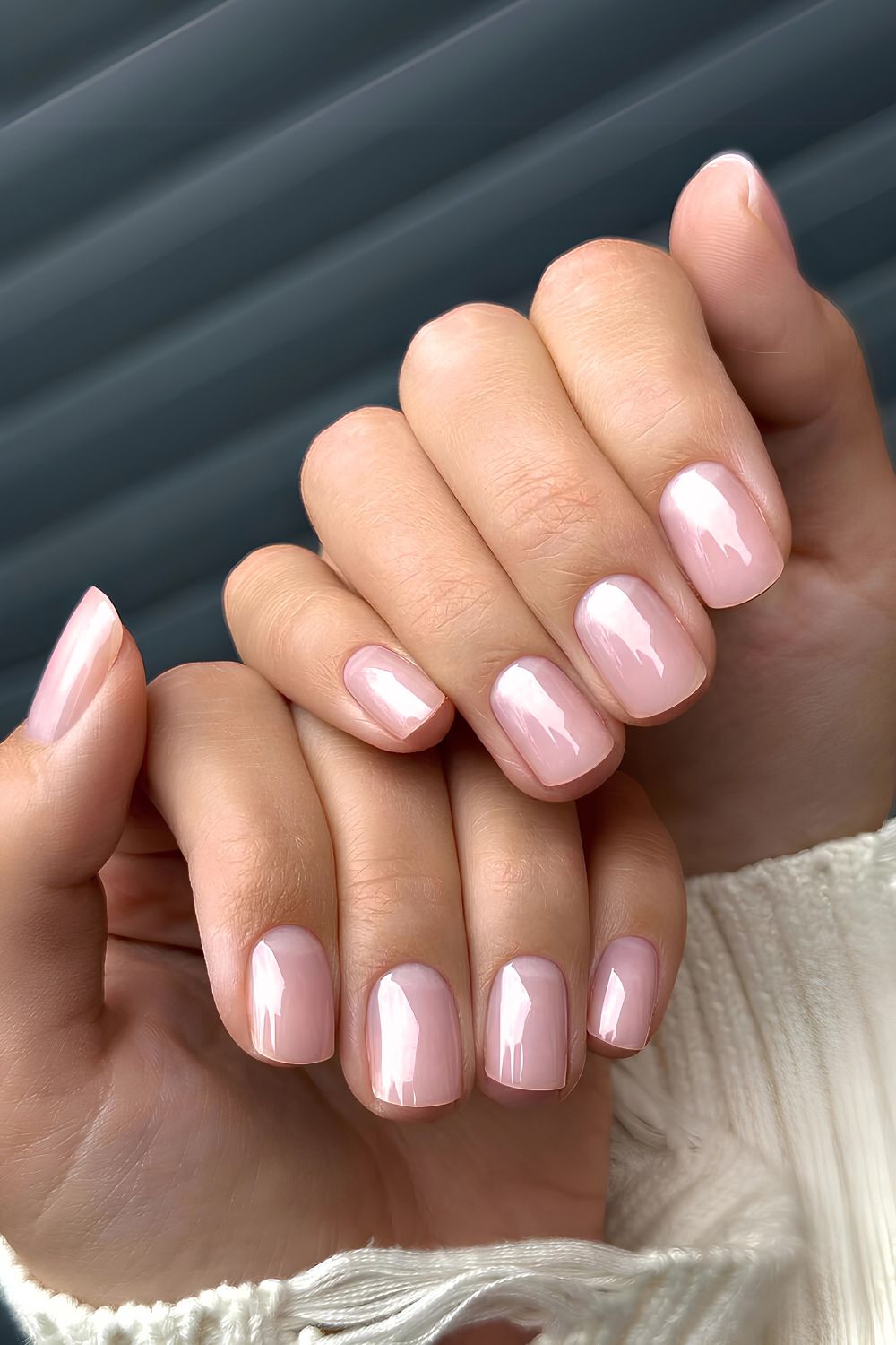 Jelly pink nails with half-moon accents