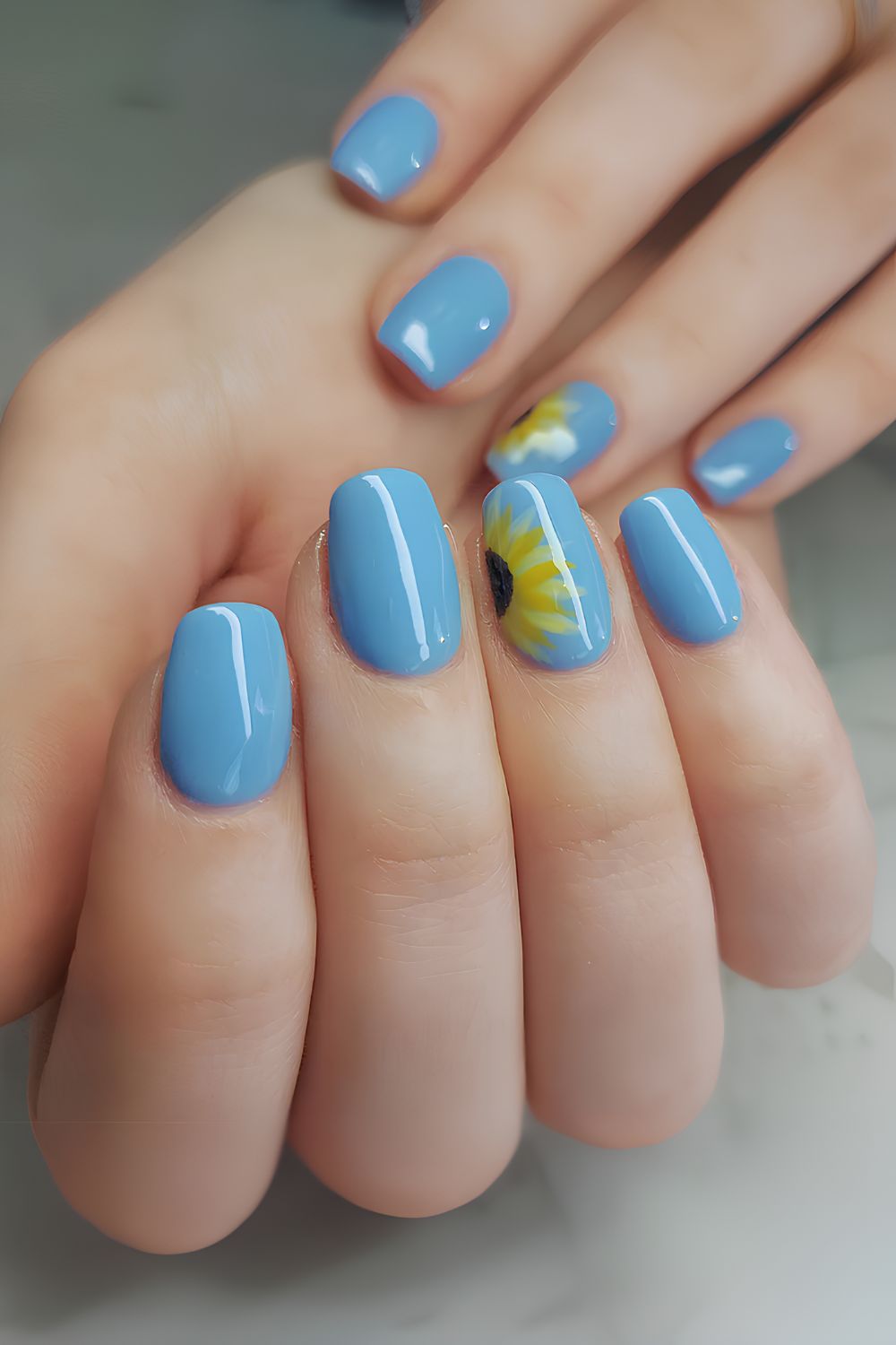 Light blue sunflower nails