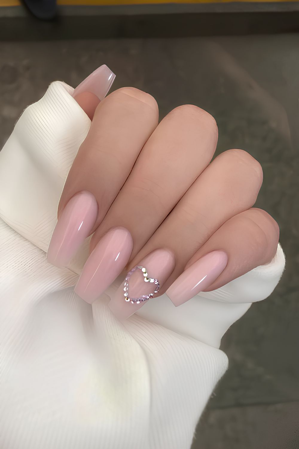 Light pink mani with rhinestone hearts