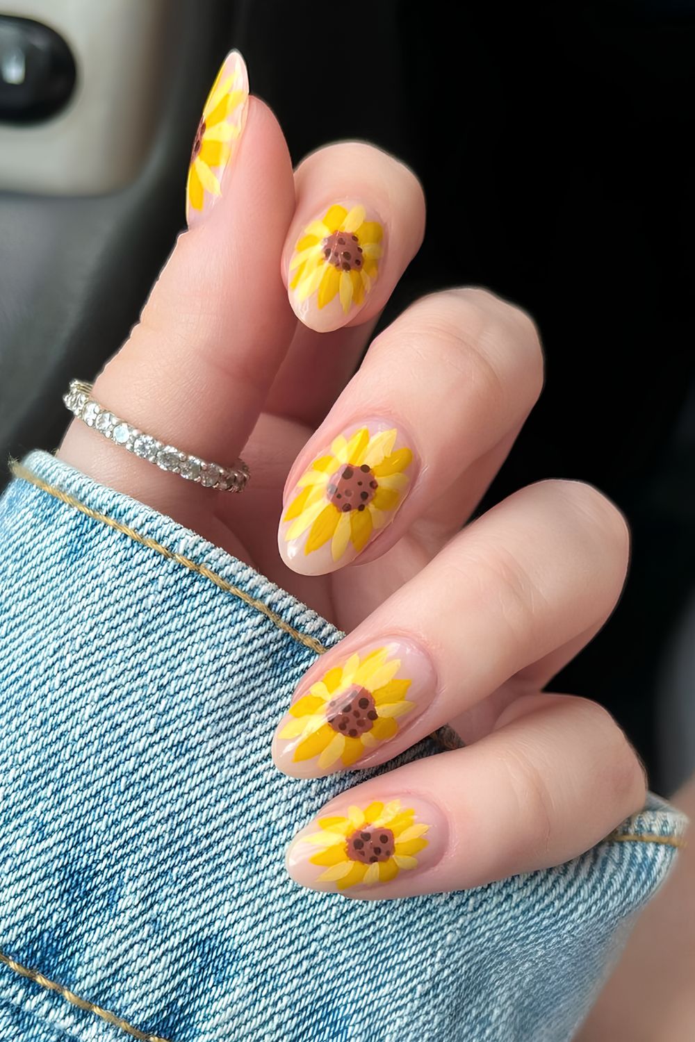 Milky nails with bold sunflowers