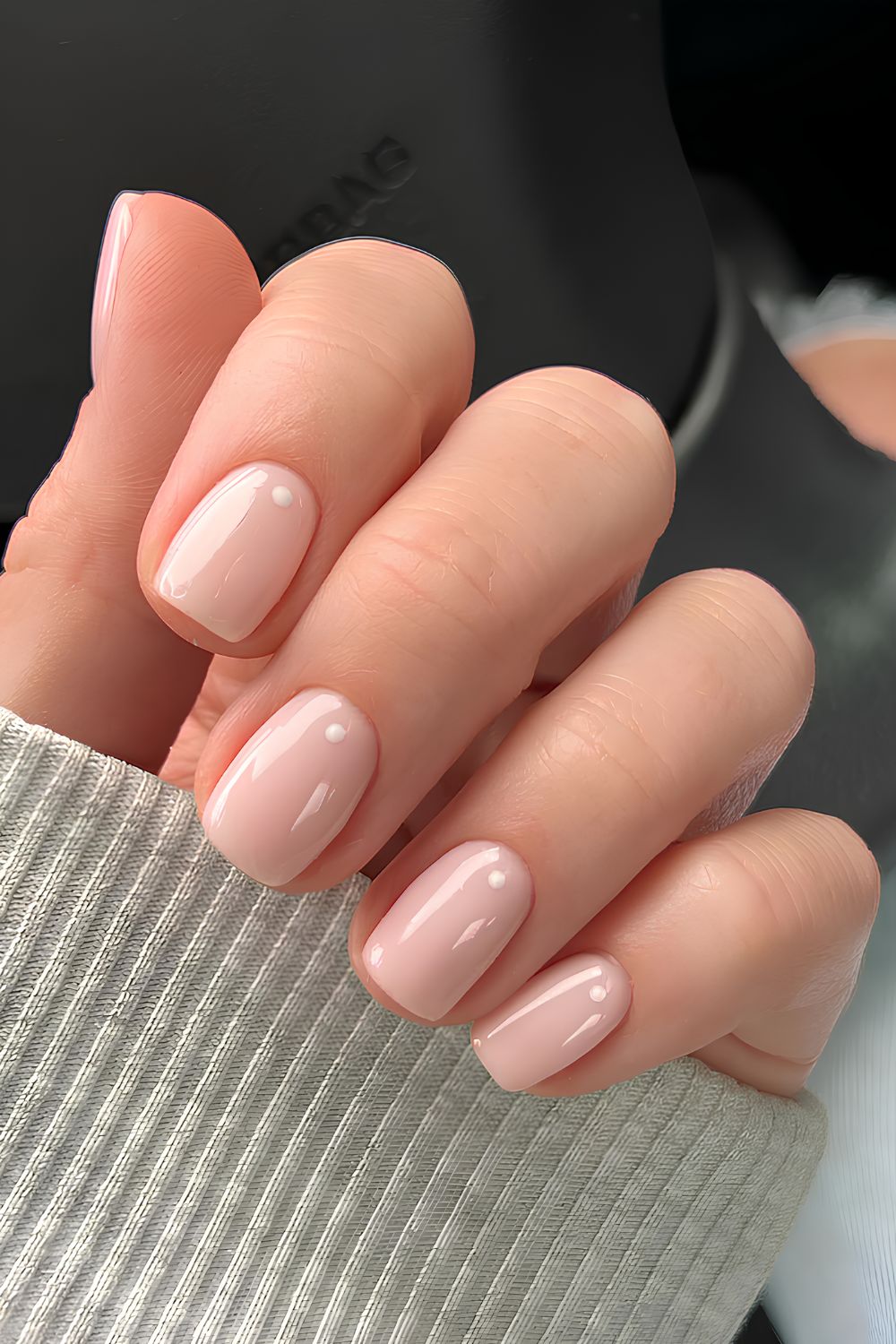 Milky pink nails with dot accents