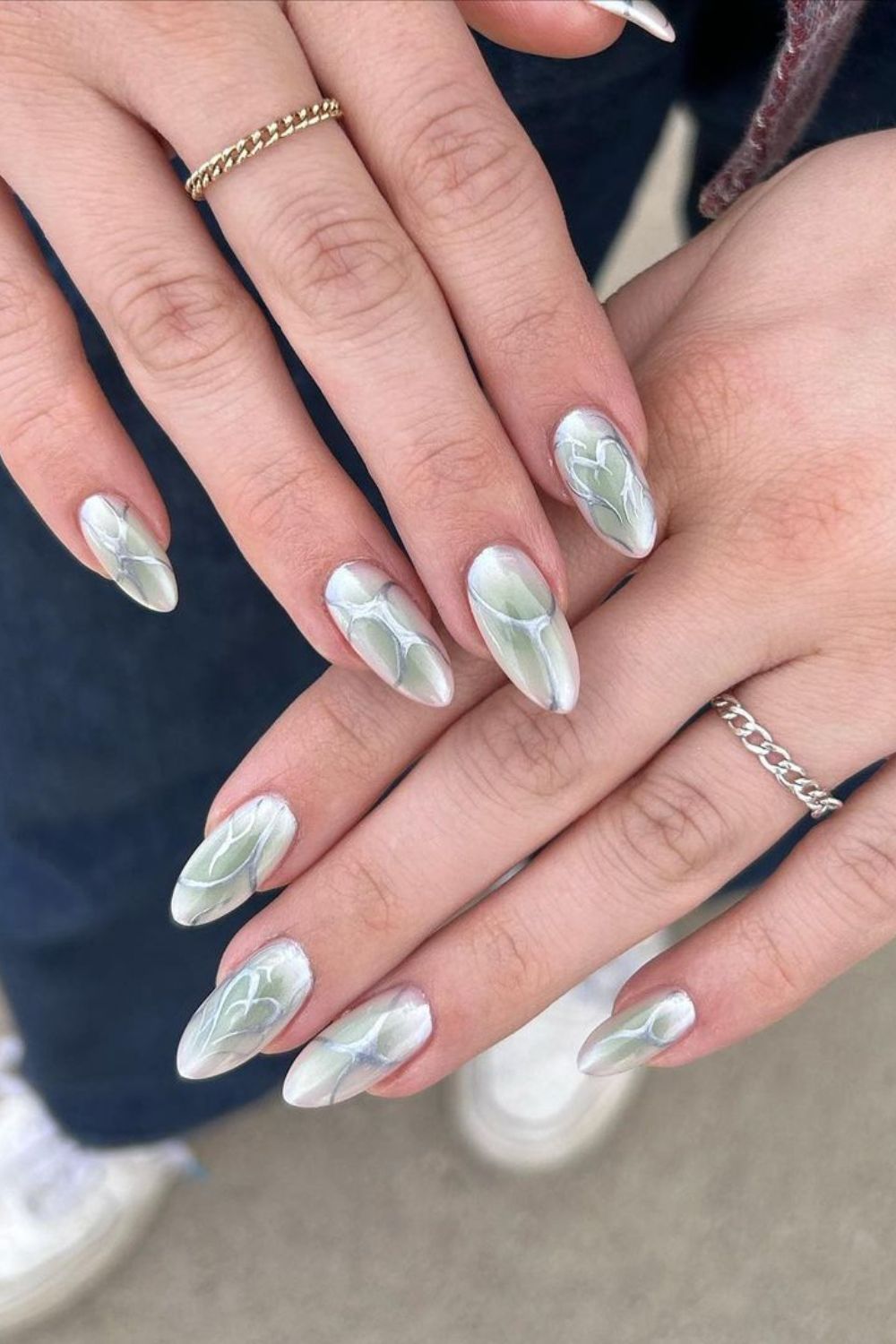 Milky white and jade green aura nails