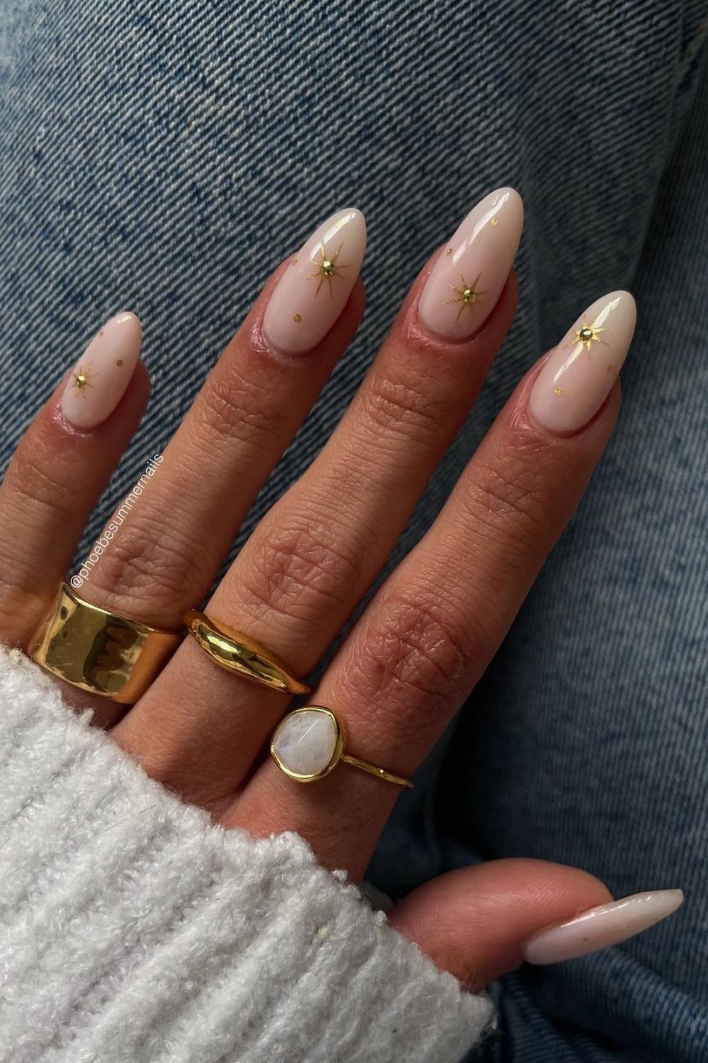 Milky white nails with gold charms