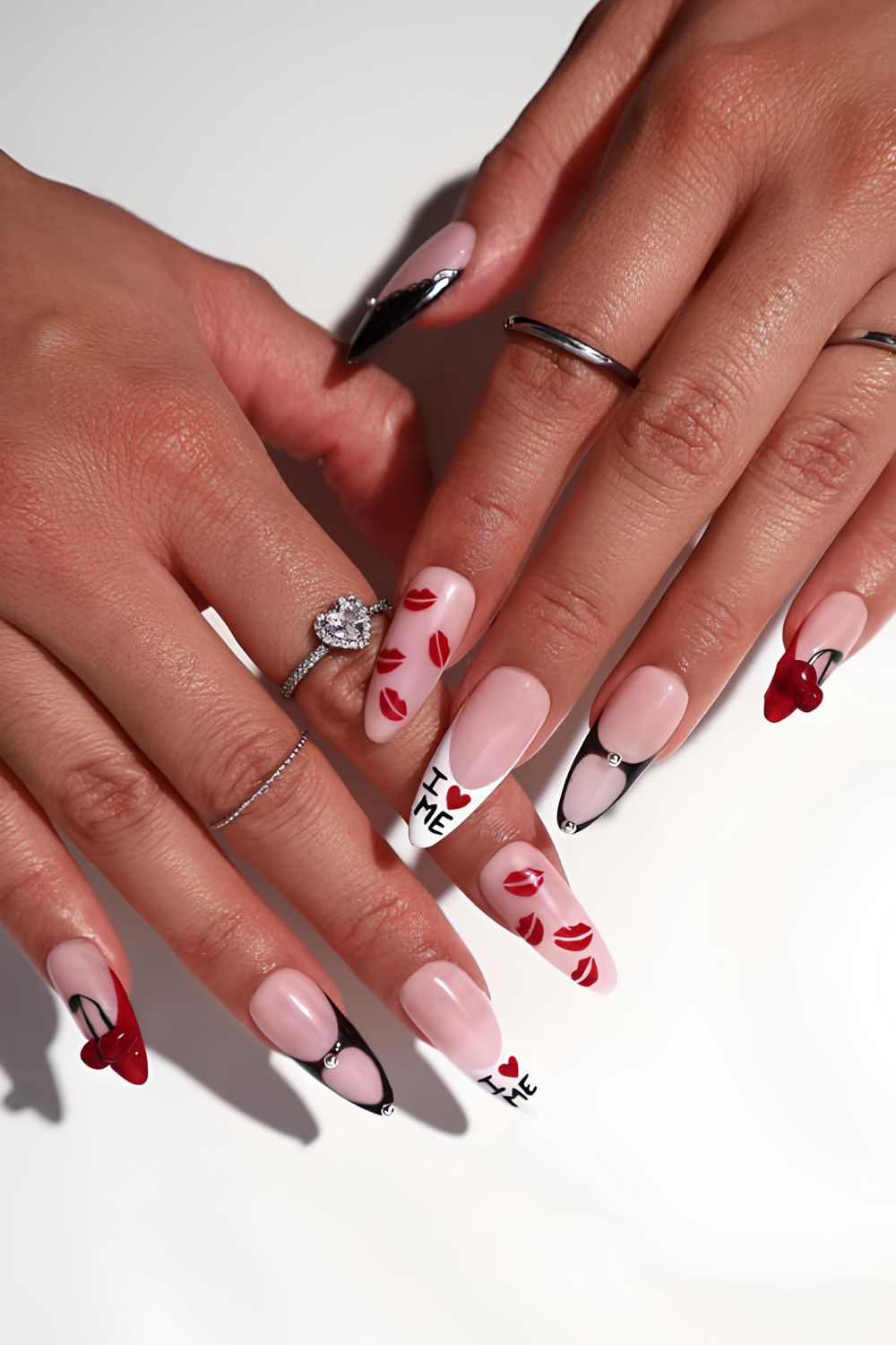 Mismatched Valentines nails with lip print, letters and cherries