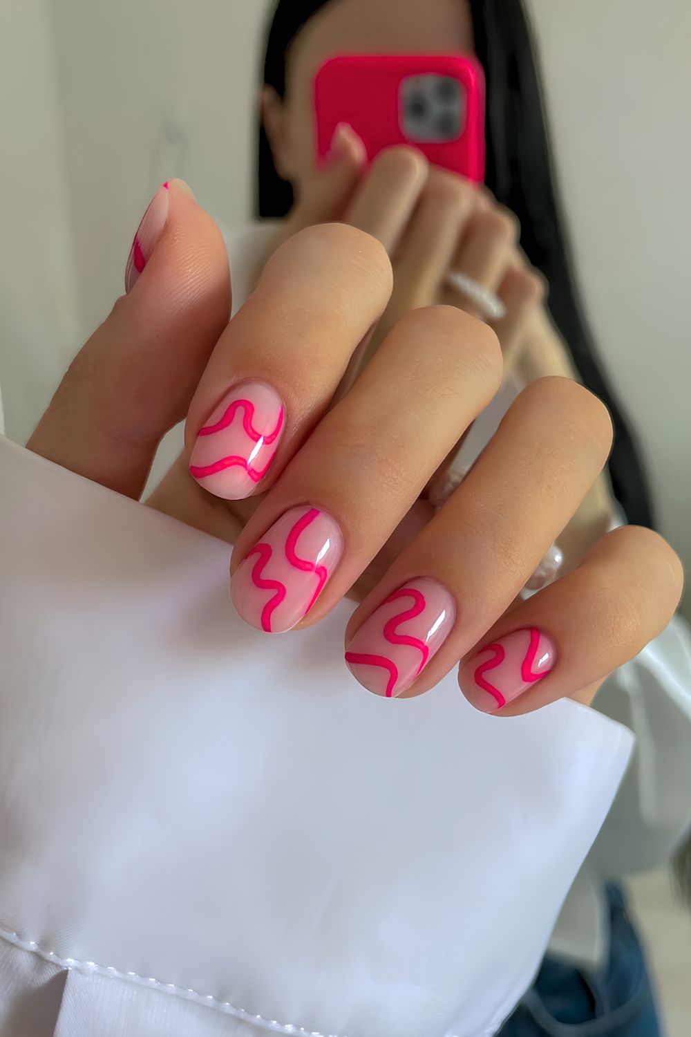 Nails with hot pink abstract swirls