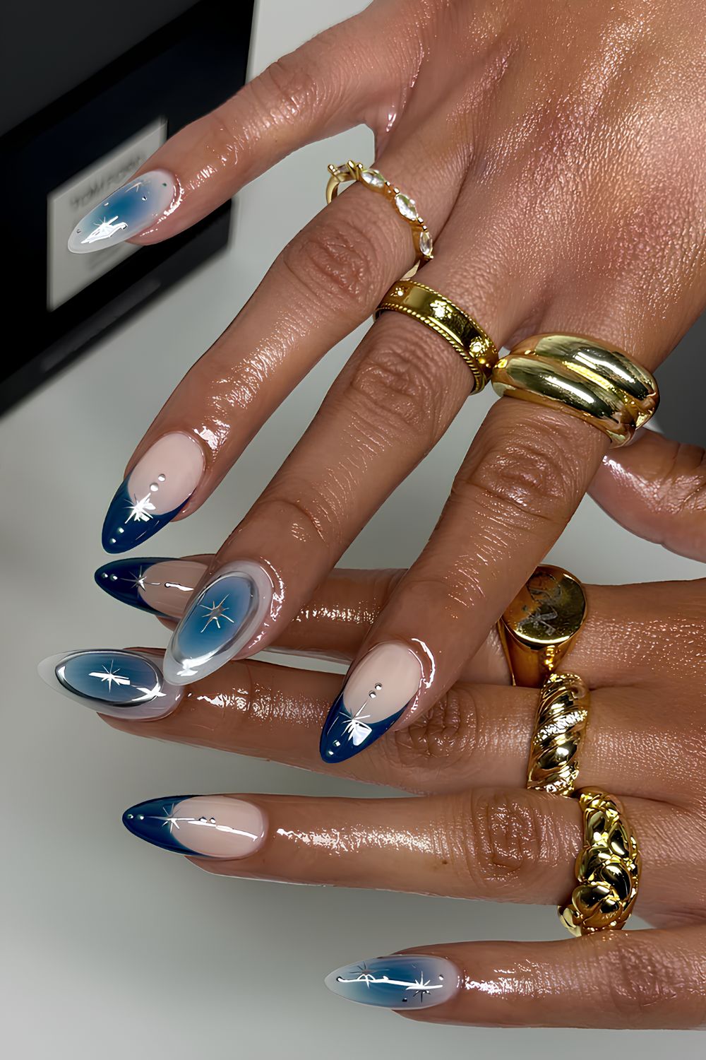 Navy French nails with aura and celestial accents