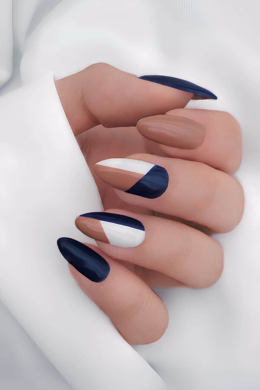 Navy and brown nails with geometric art