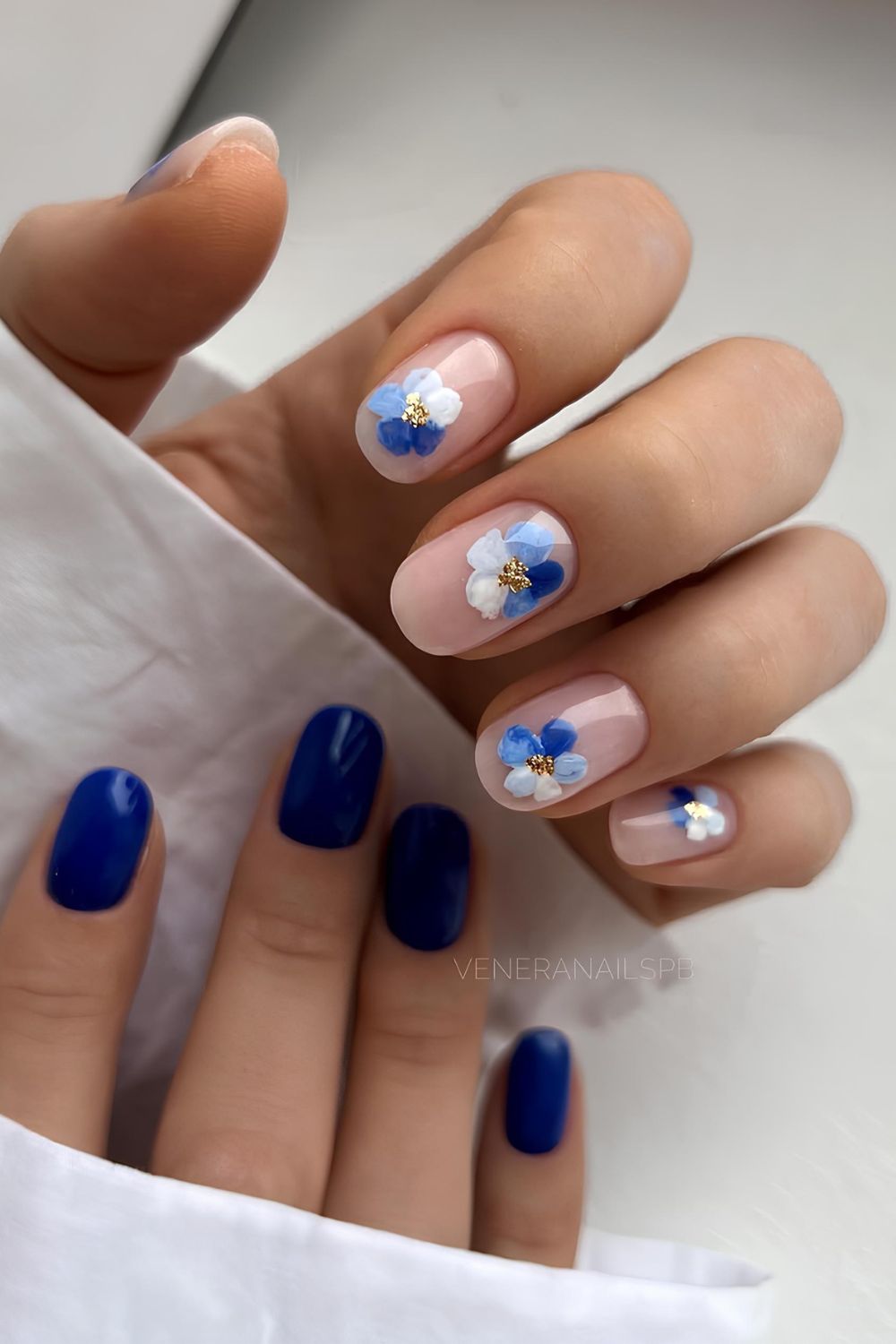 Navy blue and white floral mani