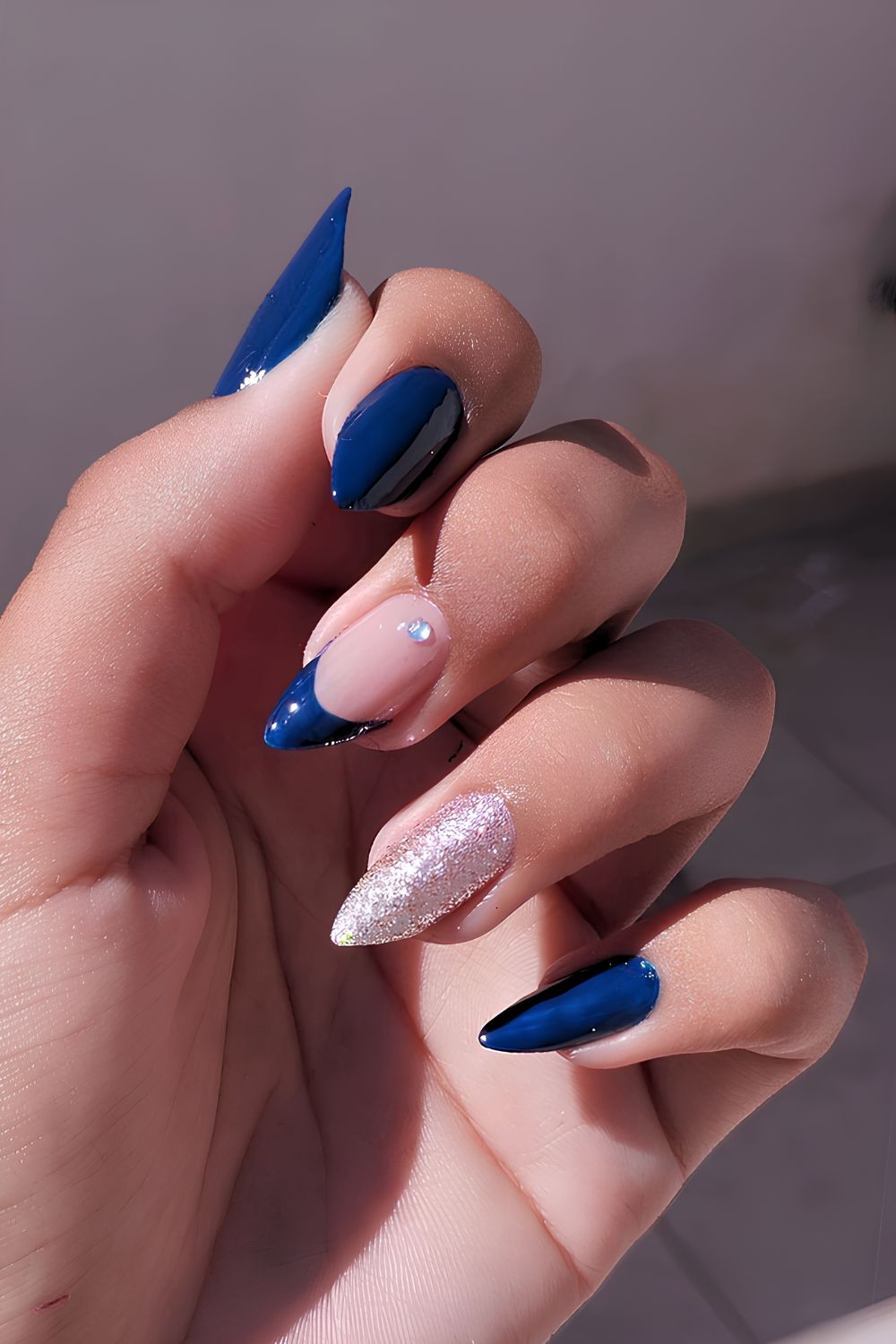 Navy blue mani with glitter and gems