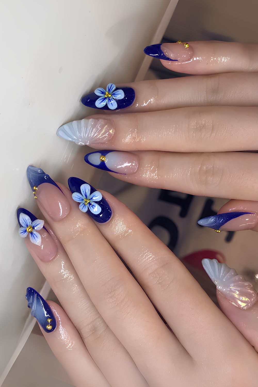 Navy blue mani with sculpted flower accents