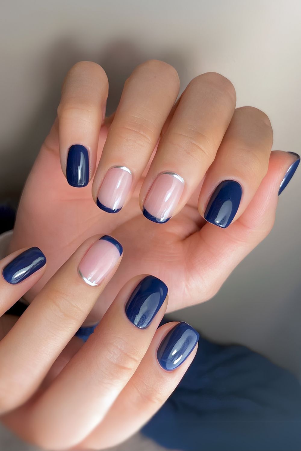 Navy blue manicure with silver accents