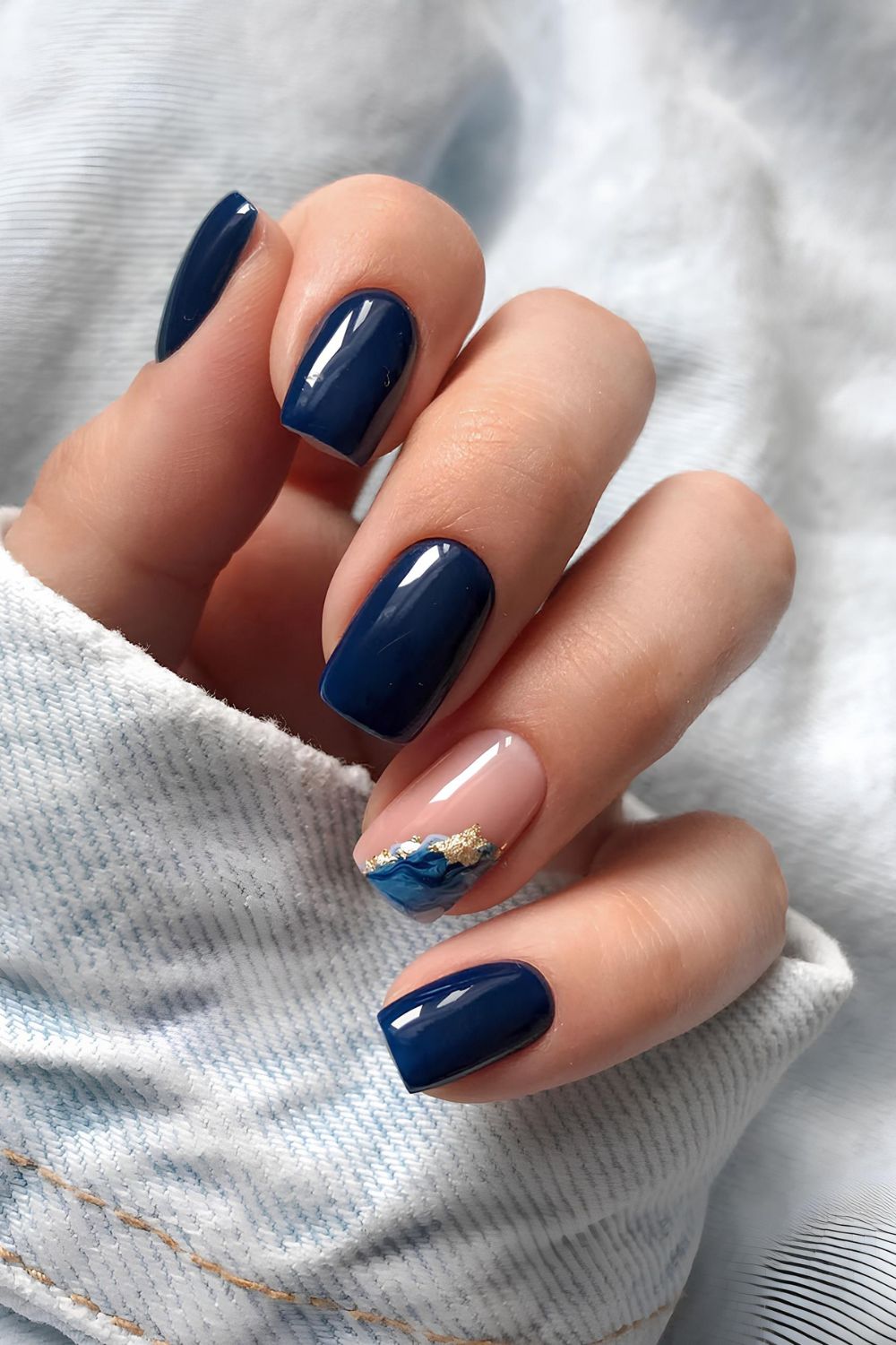 Navy mani with marble and gold accent