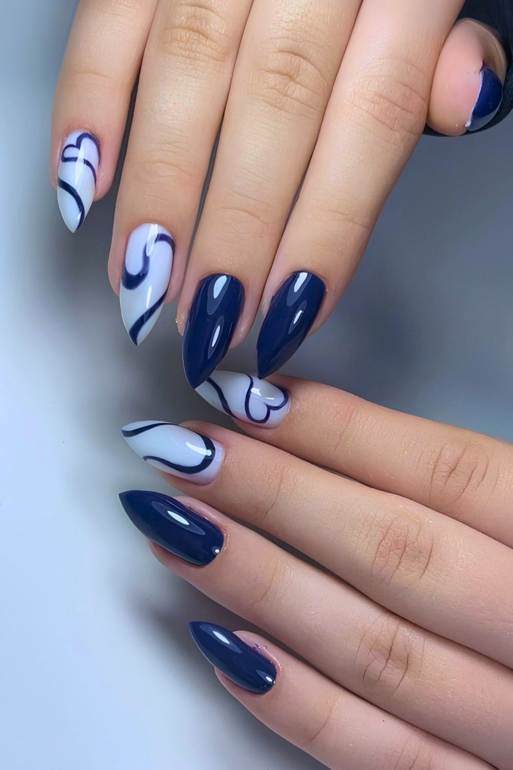 Navy mani with swirly hearts