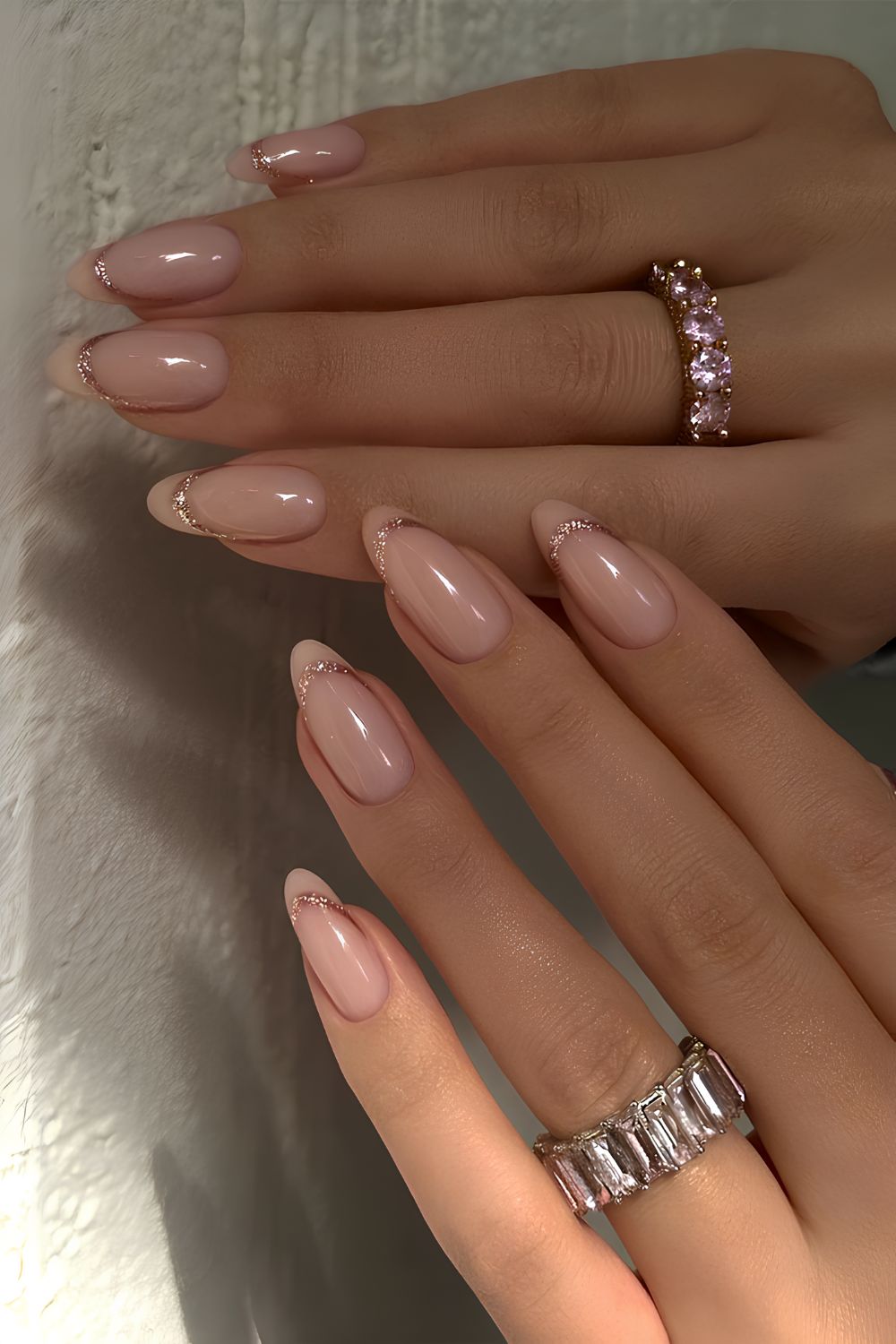 Neutral glitter-edged French nails