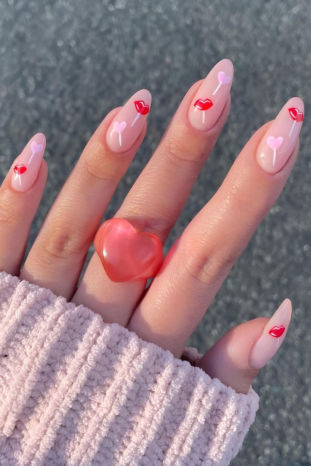 Neutral nails with heart and kisses lollipops nail art