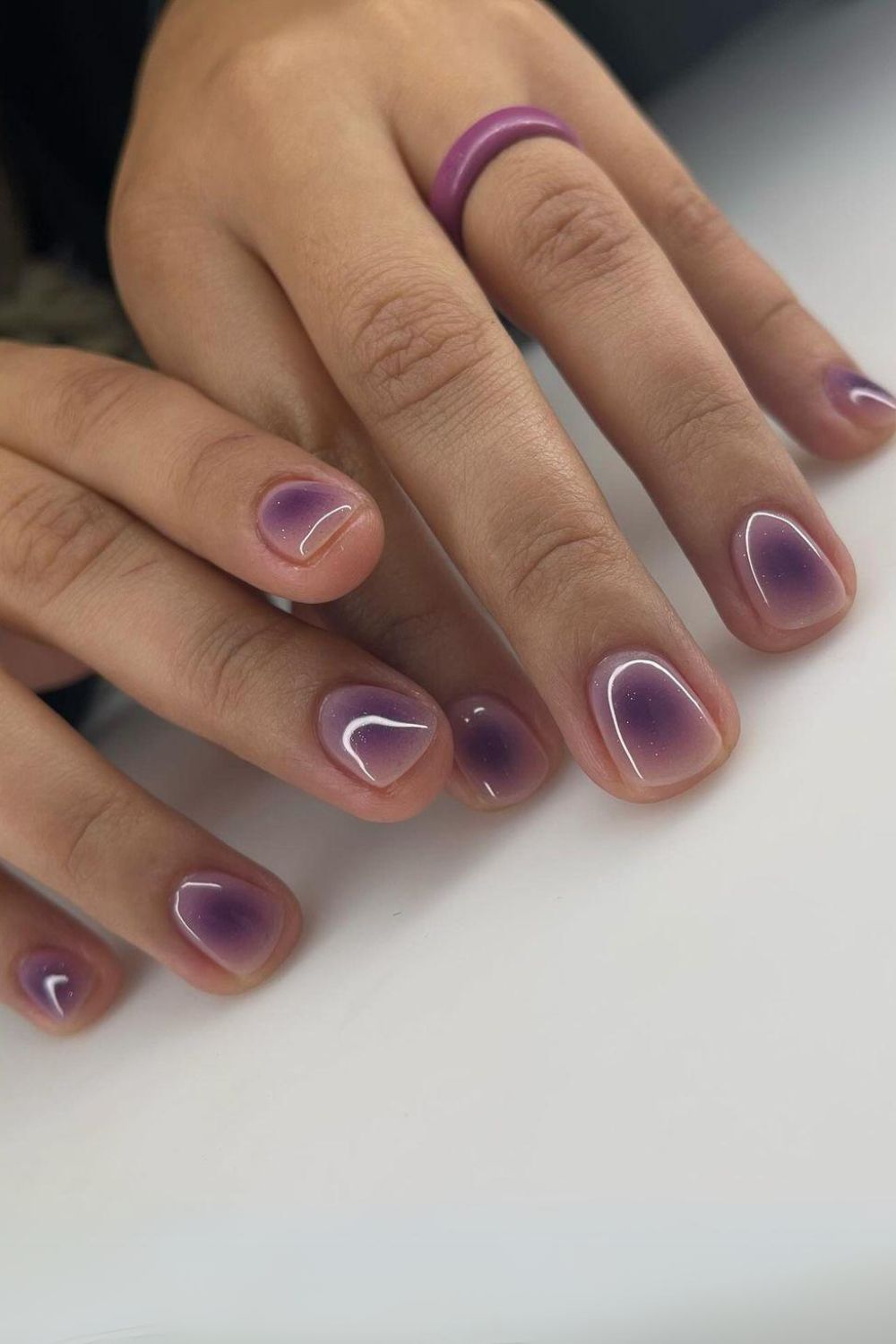 Nude nails with purple halo effect