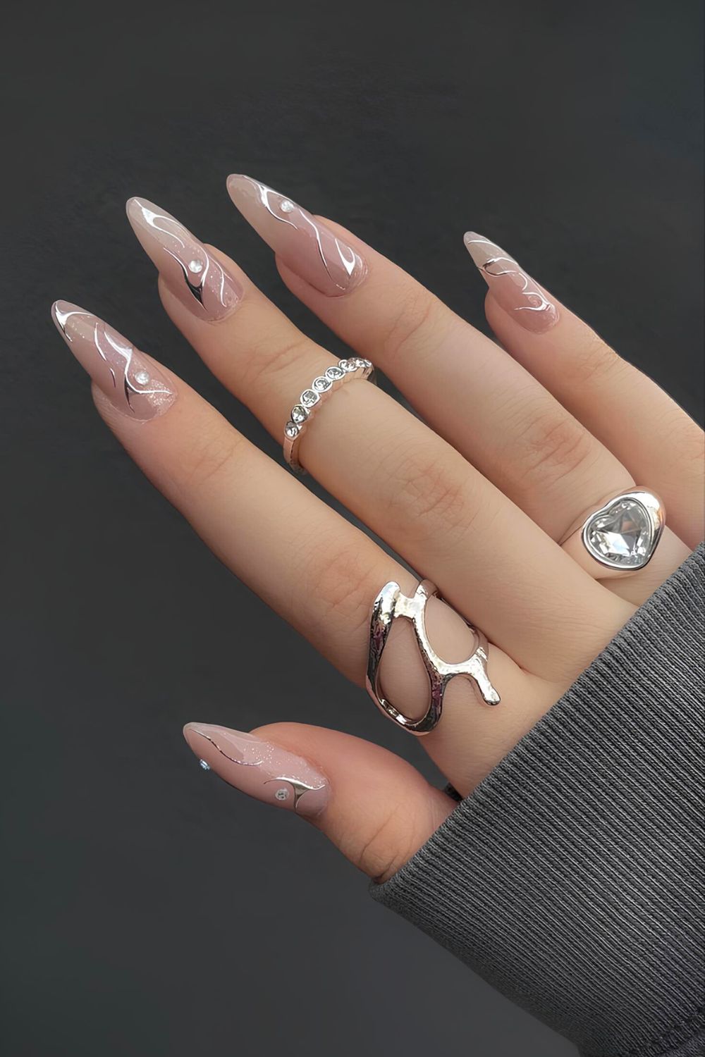 Nude nails with rhinestones and silver chrome accents