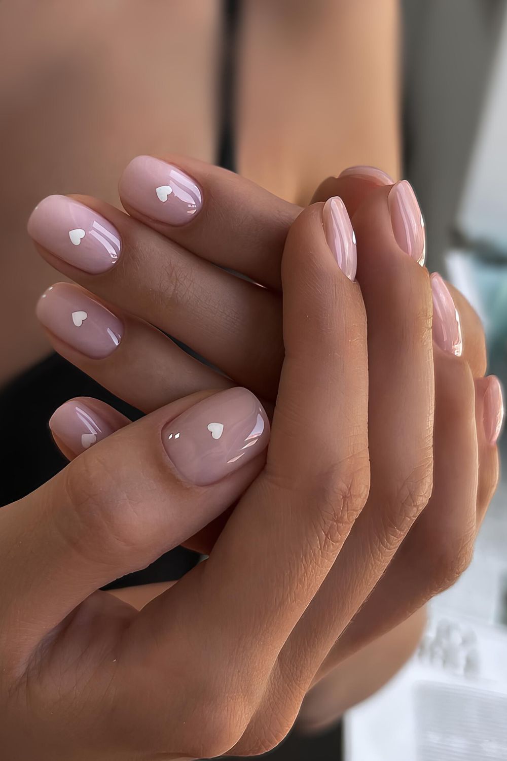 Nude nails with white hearts