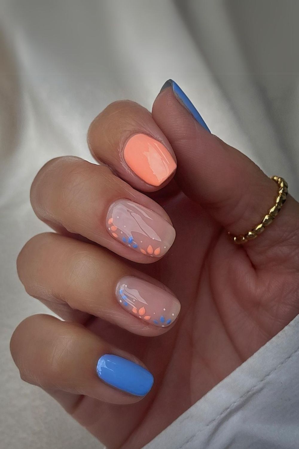 Peach and blue floral nails