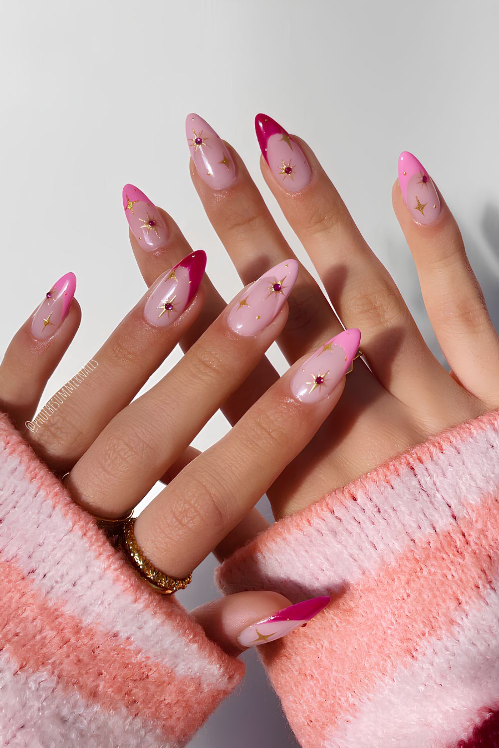 Pink French nails with celestial charms