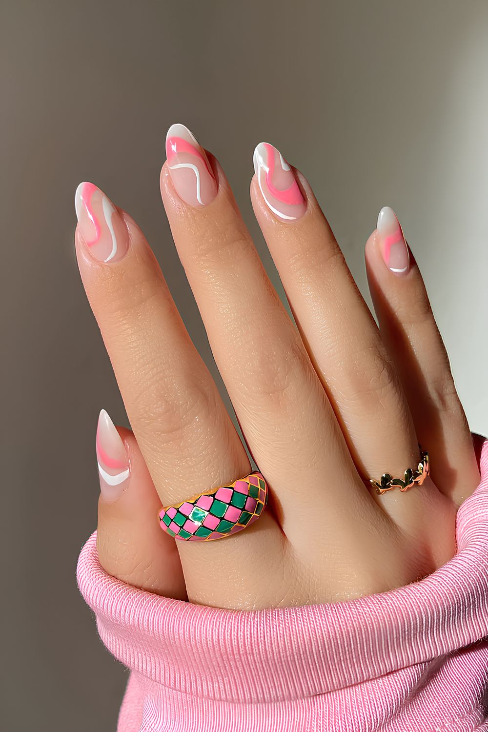 Pink and white swirl design nails