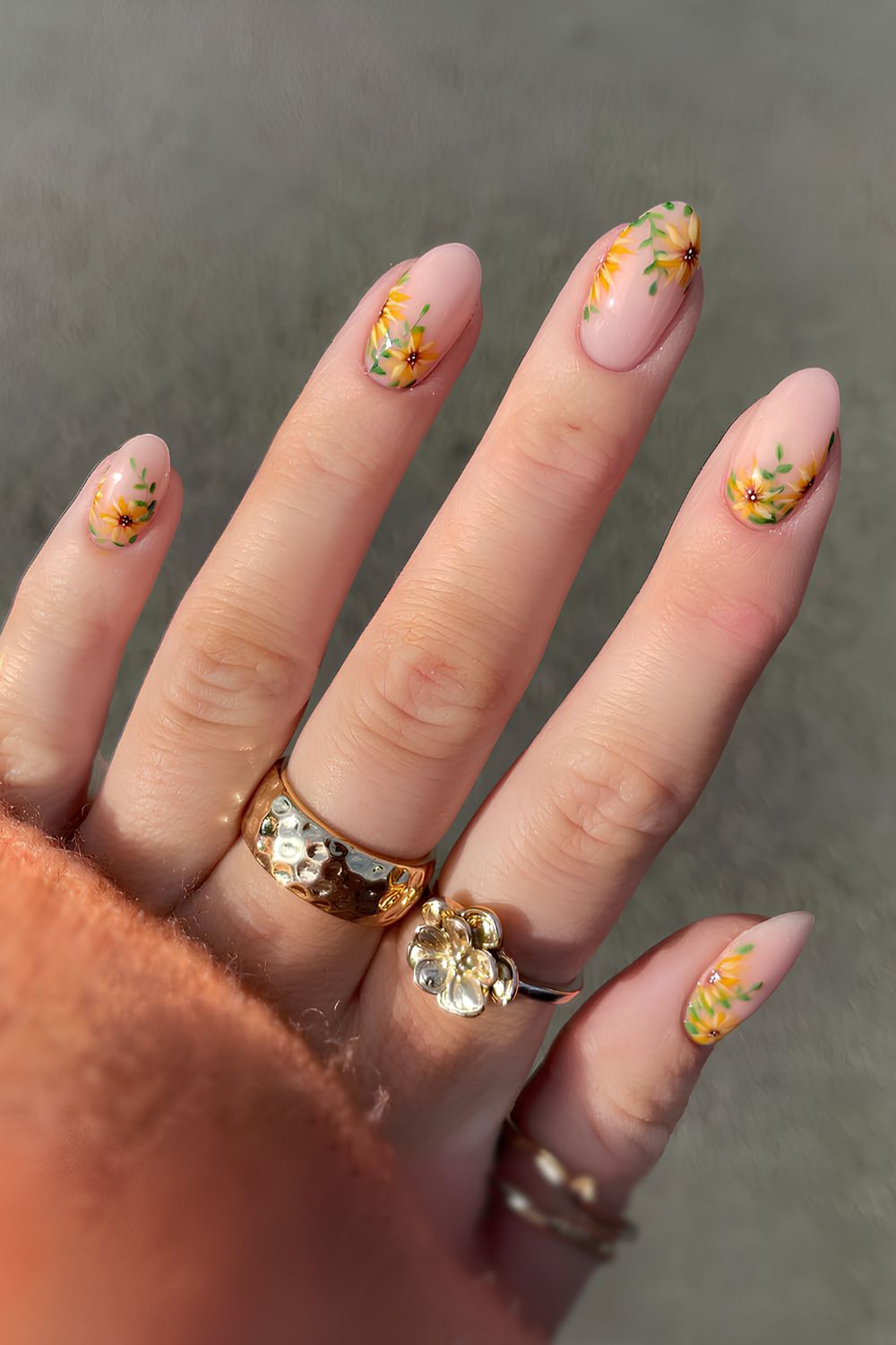 Pink nails with intricate sunflower art