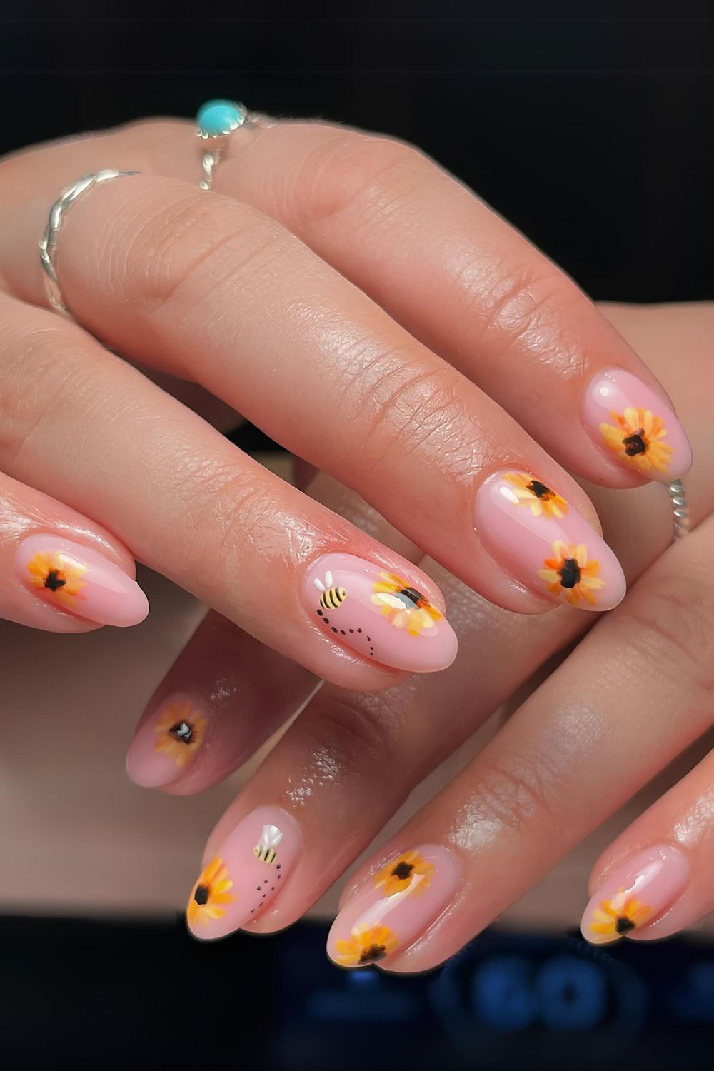 Pink nails with sunflowers and bees