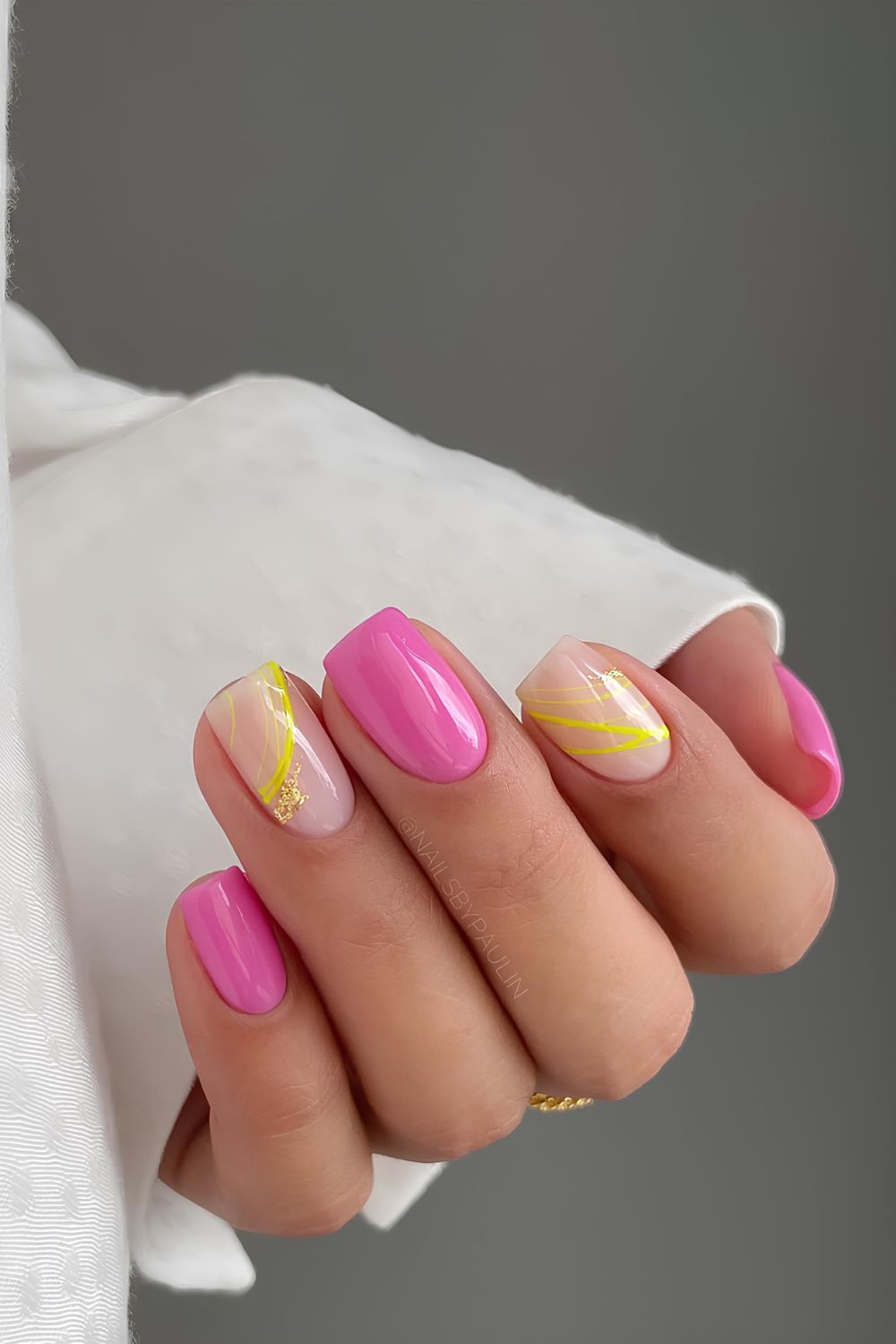 Pink nails with yellow lines