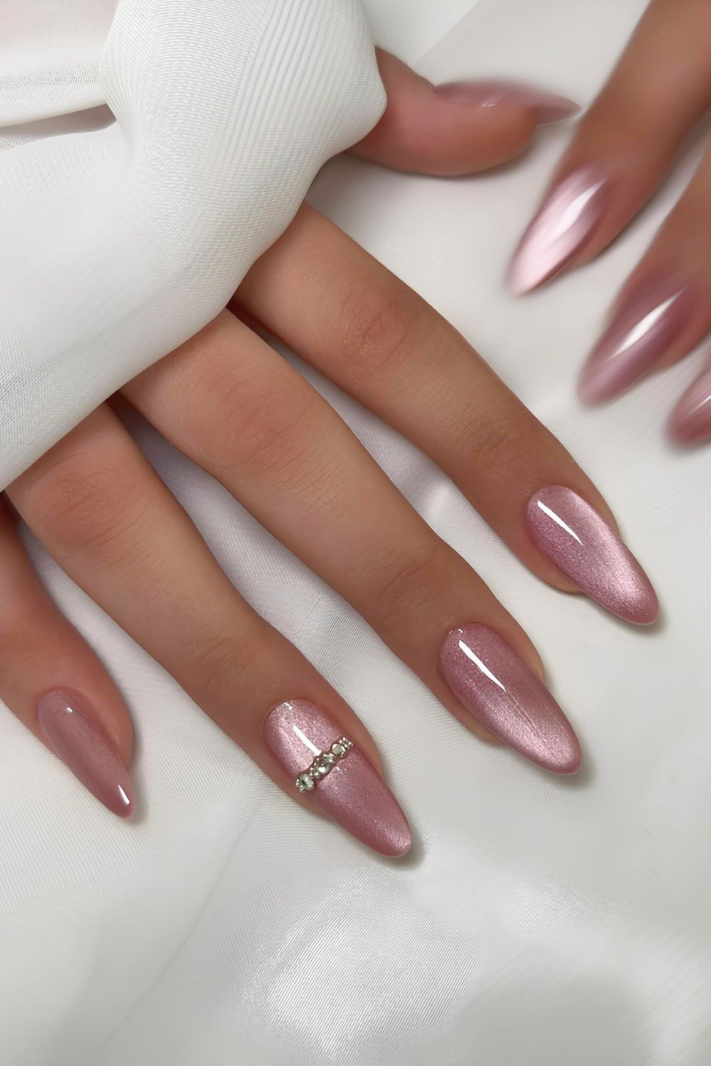 Pink velvet nails with crystal accents