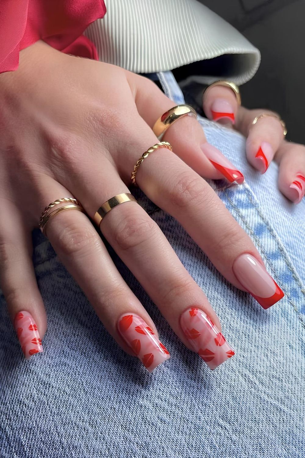 Red French nails with kissy lip art