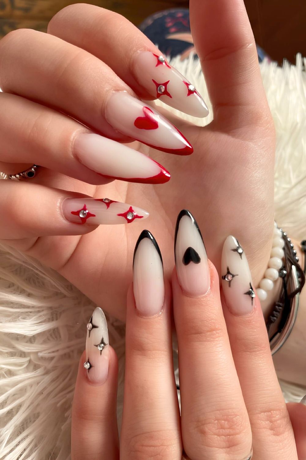 Red and black French nails with hearts and rhinestones