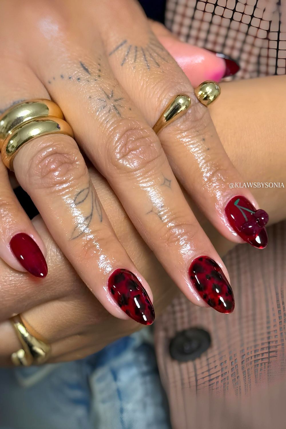 Red and black tortoise nails with 3d cherry accent