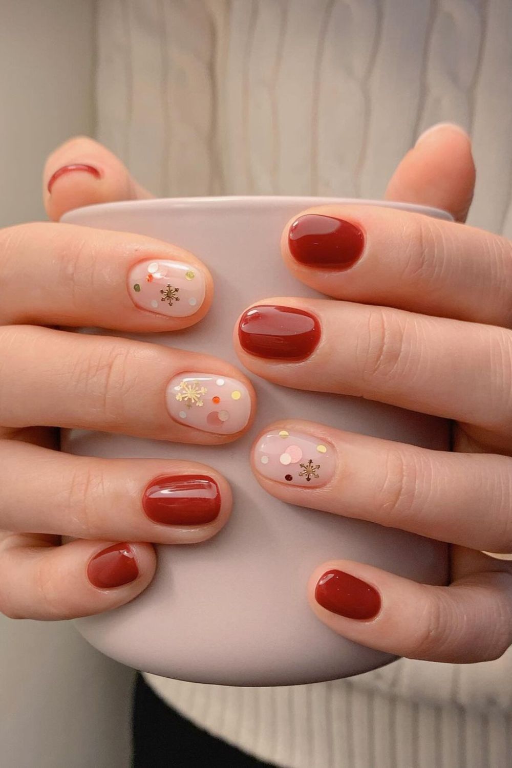 Red and milky white nails with snowflakes