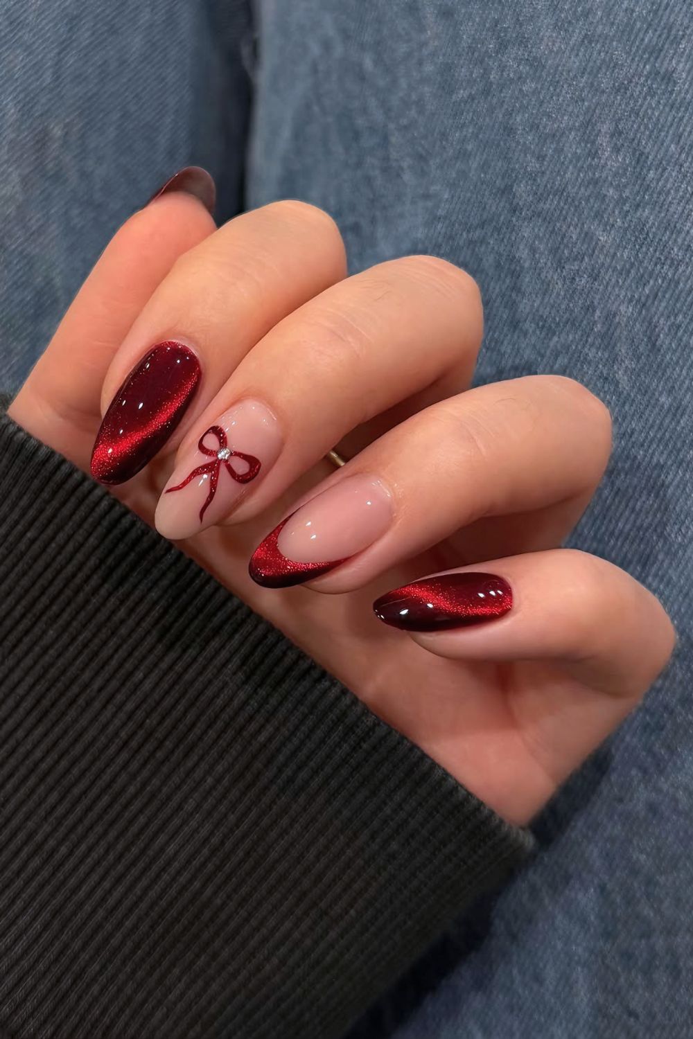 Red cat eye nails with bows