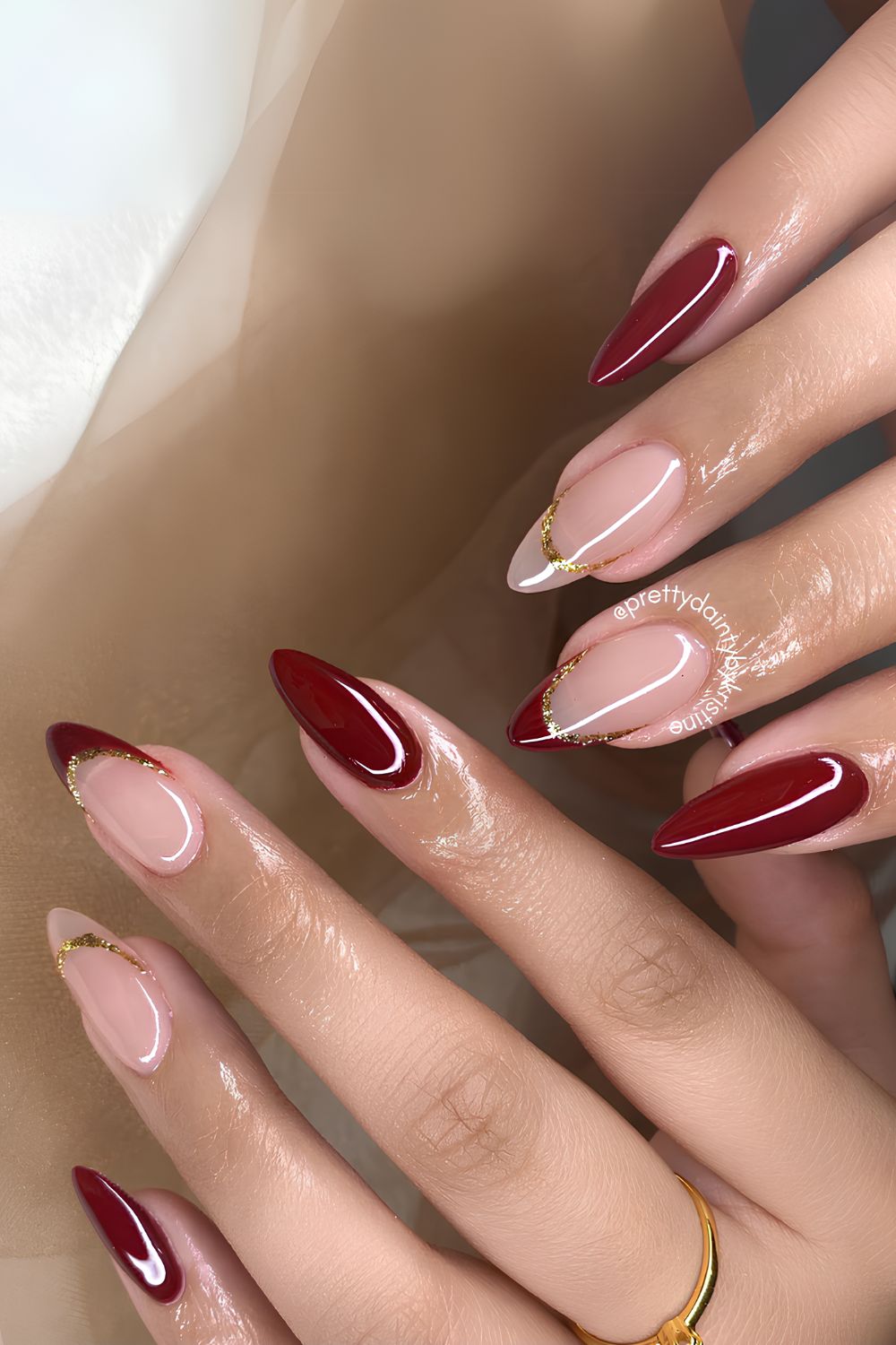 Red mani with glitter-edged accent tips